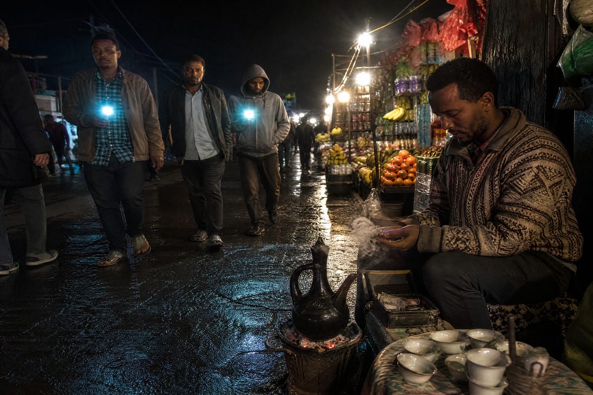 Night market, coffee jebena, phone flashlights